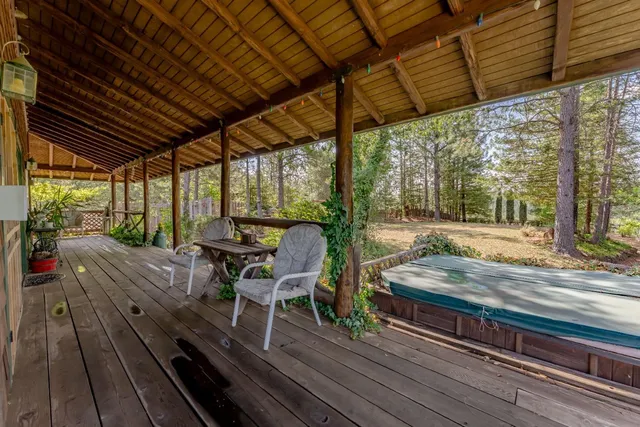 a view of a wooden deck with a bench