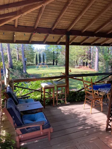 a view of a chairs and table in the patio