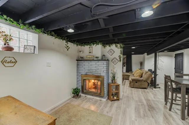 a view of an empty room with a fireplace