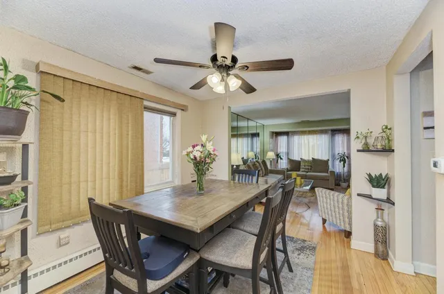 a view of a dining room with furniture and window