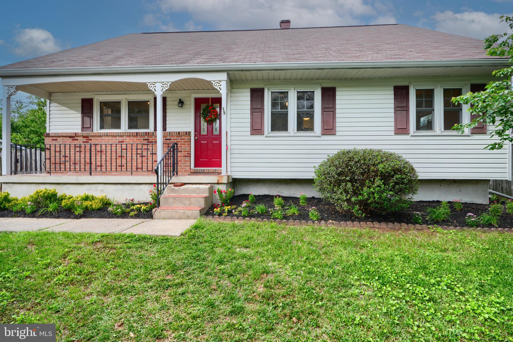 4112 Lochcarrow Road Nottingham, MD 21236 - Photo 2 of 30 a front view of a house with a yard and garage