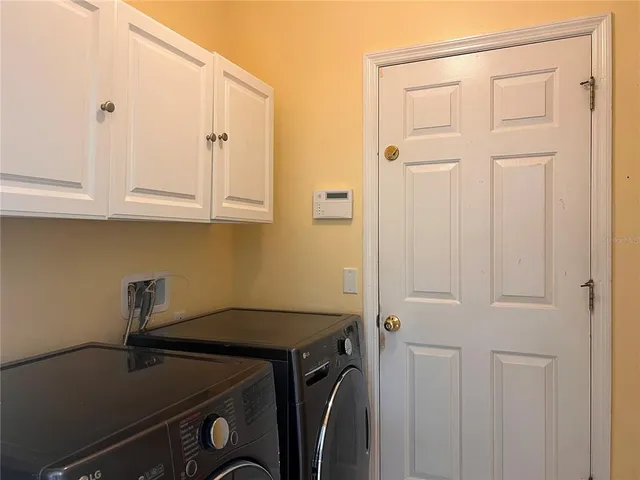 a view of a storage and utility room with sink