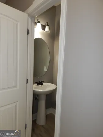a bathroom with a sink and mirror