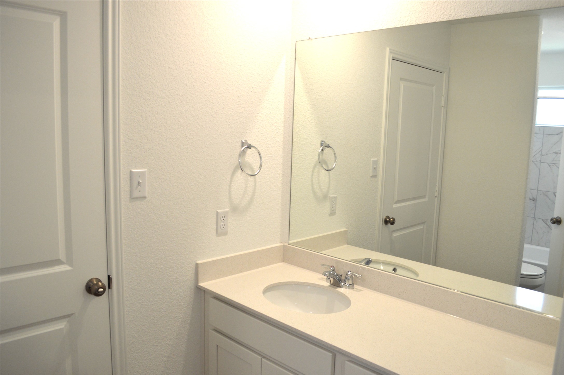 1524 Marley Kyle, TX 78640 - Photo 14 of 22 Bathroom with a textured wall and vanity