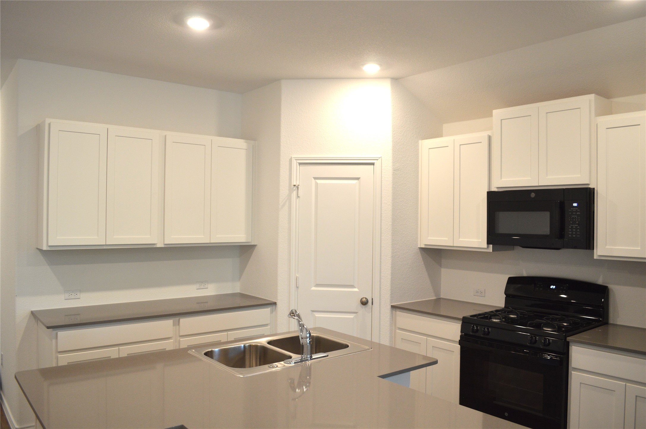 1524 Marley Kyle, TX 78640 - Photo 4 of 22 Kitchen featuring black appliances, white cabinets, and recessed lighting