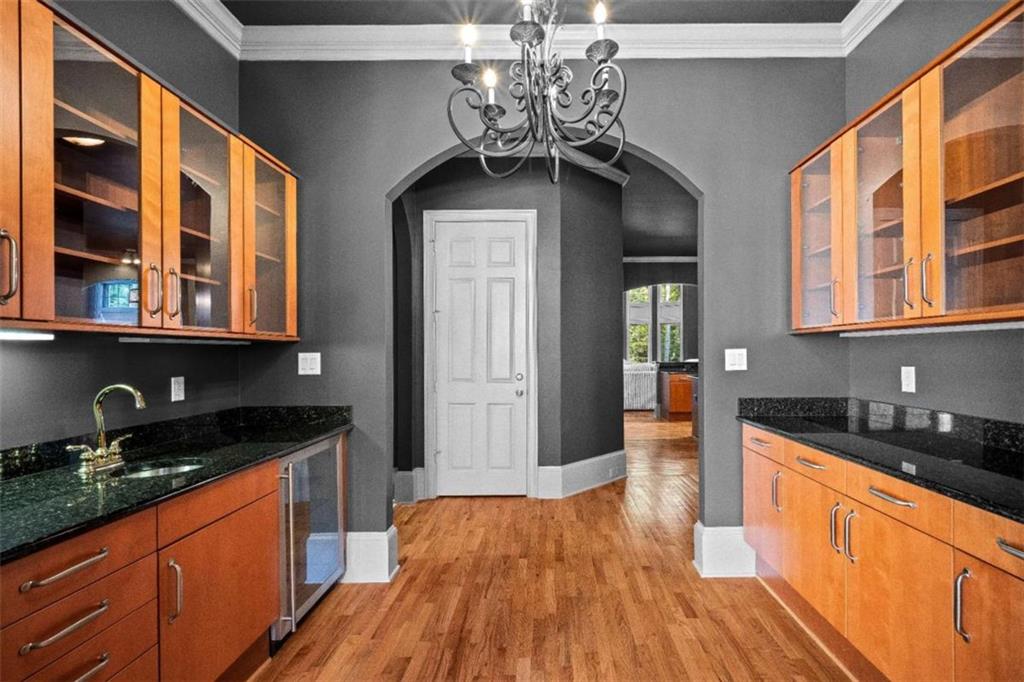 1670 Riverside Road Roswell, GA 30076 - Photo 12 of 88 a kitchen with stainless steel appliances granite countertop a sink and wooden cabinets