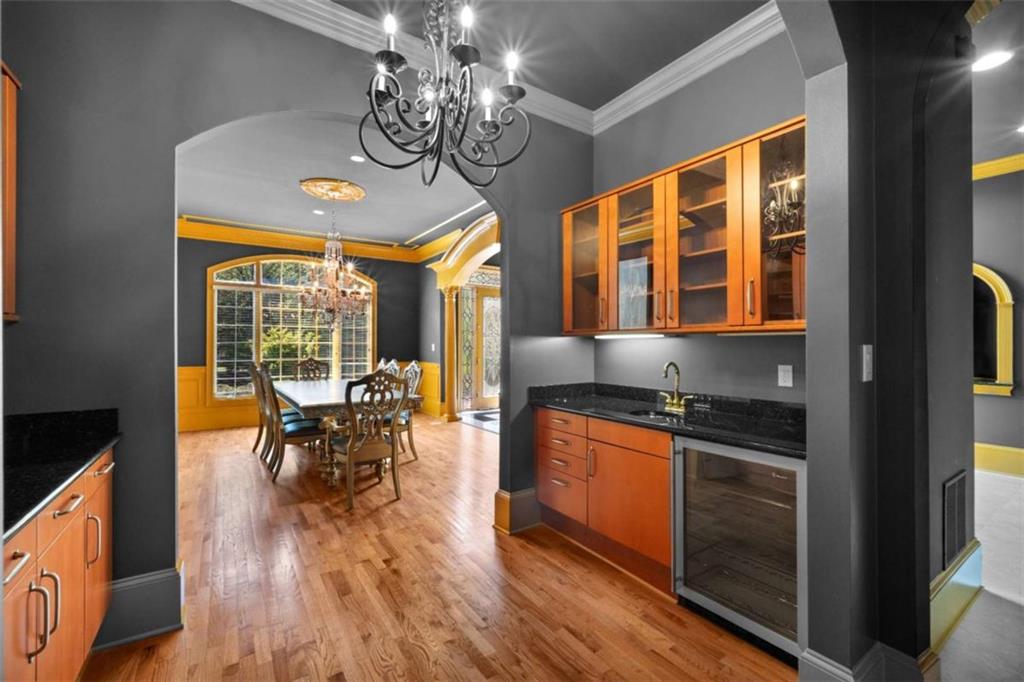 1670 Riverside Road Roswell, GA 30076 - Photo 13 of 88 a view of a dining room with furniture window and wooden floor