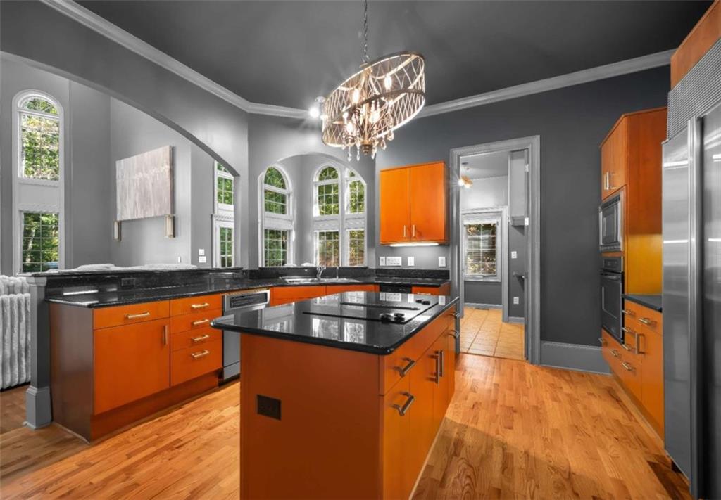 1670 Riverside Road Roswell, GA 30076 - Photo 17 of 88 a kitchen with stainless steel appliances granite countertop a sink stove and refrigerator