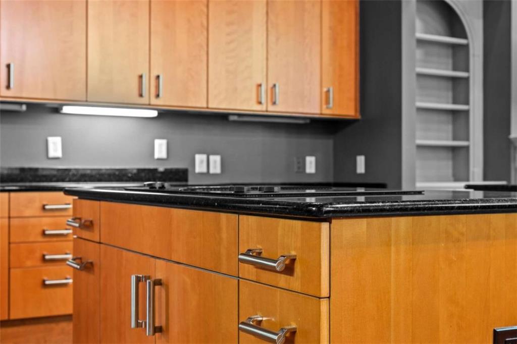 1670 Riverside Road Roswell, GA 30076 - Photo 23 of 88 a kitchen with granite countertop a sink and cabinets