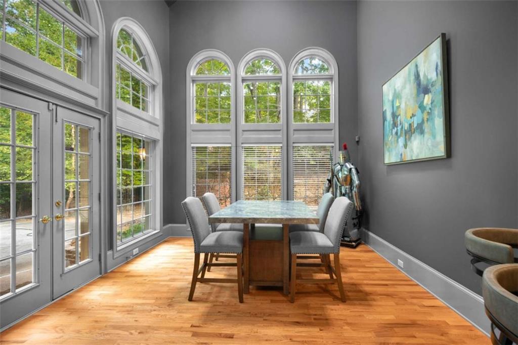 1670 Riverside Road Roswell, GA 30076 - Photo 29 of 88 a view of a dining room with furniture a chandelier and wooden floor