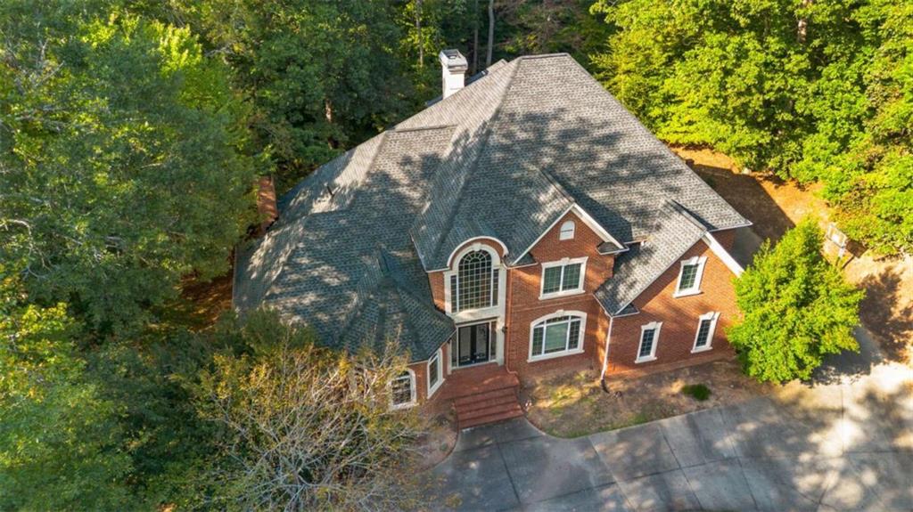 1670 Riverside Road Roswell, GA 30076 - Photo 3 of 88 a front view of a house with garden