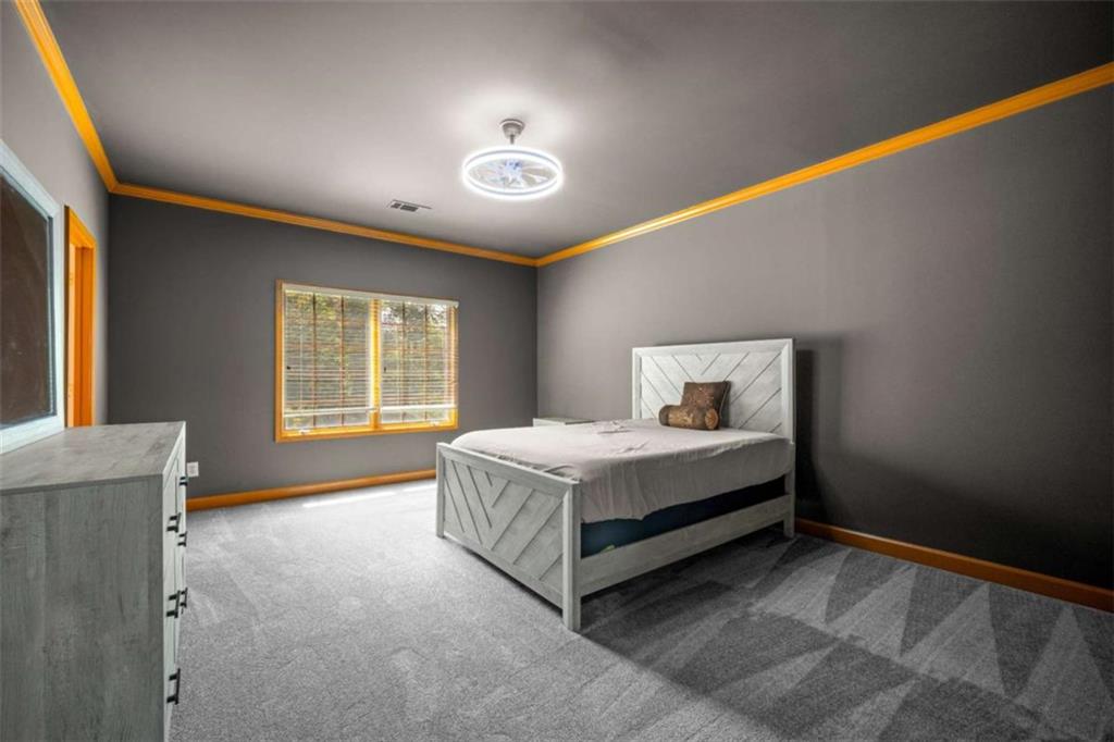1670 Riverside Road Roswell, GA 30076 - Photo 49 of 88 a spacious bedroom with a bed and a window