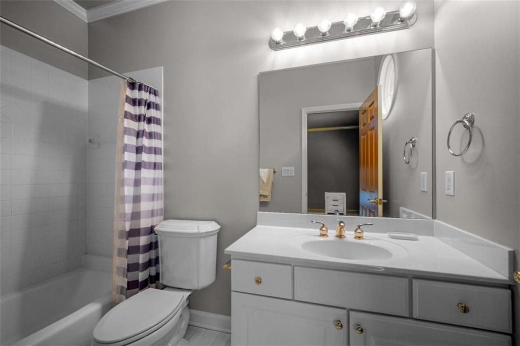 1670 Riverside Road Roswell, GA 30076 - Photo 52 of 88 a bathroom with a sink toilet and shower