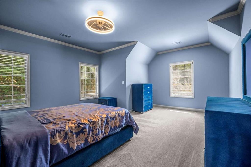 1670 Riverside Road Roswell, GA 30076 - Photo 53 of 88 a bedroom with a bed and a window