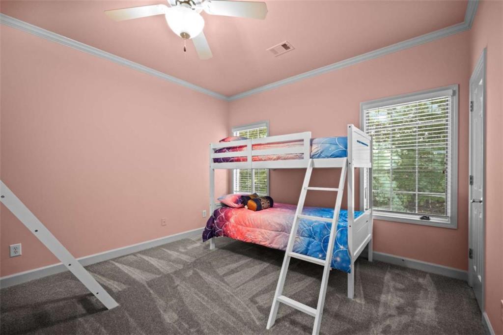 1670 Riverside Road Roswell, GA 30076 - Photo 56 of 88 a bedroom with a bed and a chandelier