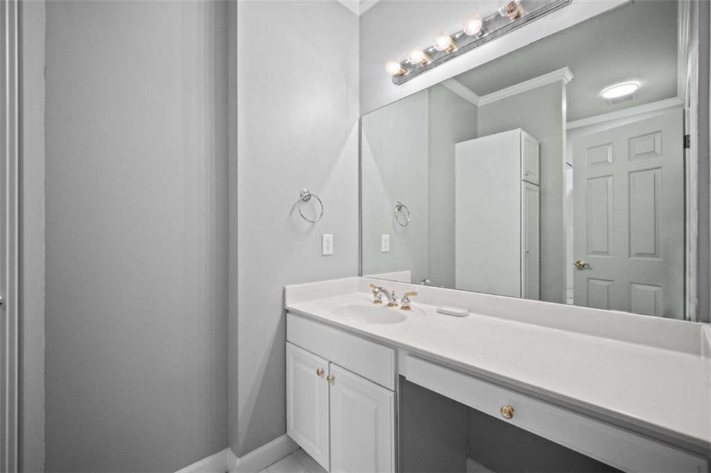 1670 Riverside Road Roswell, GA 30076 - Photo 58 of 88 a bathroom with a sink and a mirror
