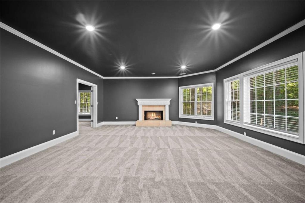 1670 Riverside Road Roswell, GA 30076 - Photo 62 of 88 a view of an empty room with a window and wooden floor
