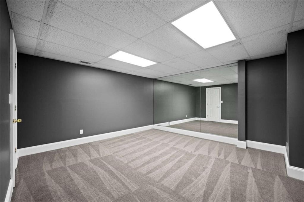 1670 Riverside Road Roswell, GA 30076 - Photo 70 of 88 a view of an empty room with wooden floor