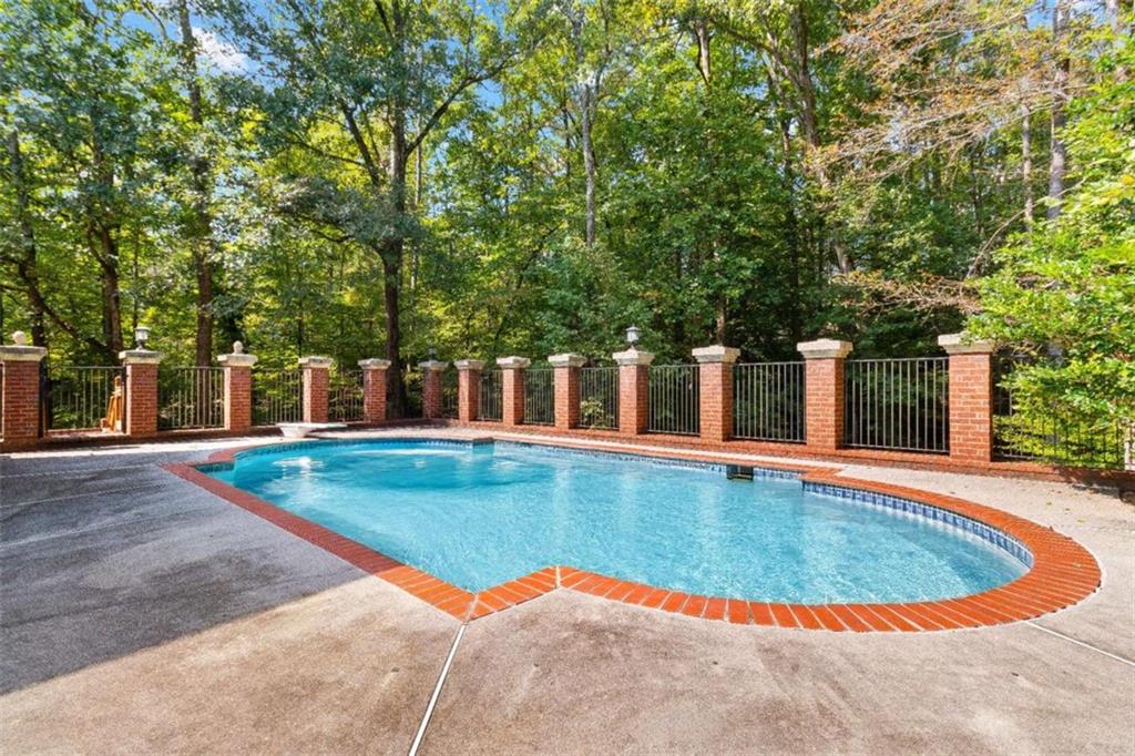 1670 Riverside Road Roswell, GA 30076 - Photo 77 of 88 a view of a swimming pool with an outdoor space