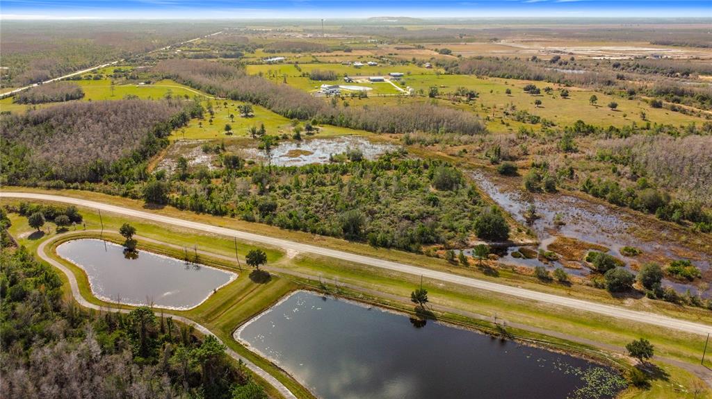 0 Community Center Road St. Cloud, FL 34773 - Photo 3 of 14 an aerial view of residential houses with outdoor space