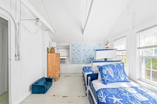 a bedroom with furniture and a fireplace