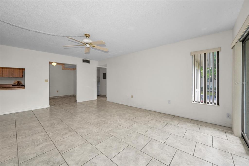 2687 Pine Ridge Way South, Unit B2 Palm Harbor, FL 34684 - Photo 5 of 68 a view of an empty room with a window