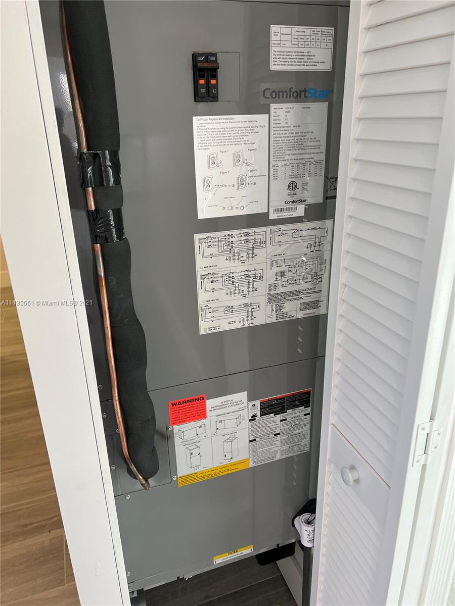 8935 Southwest 38th Street Miami, FL 33165 - Photo 15 of 24 a room with storage and utility