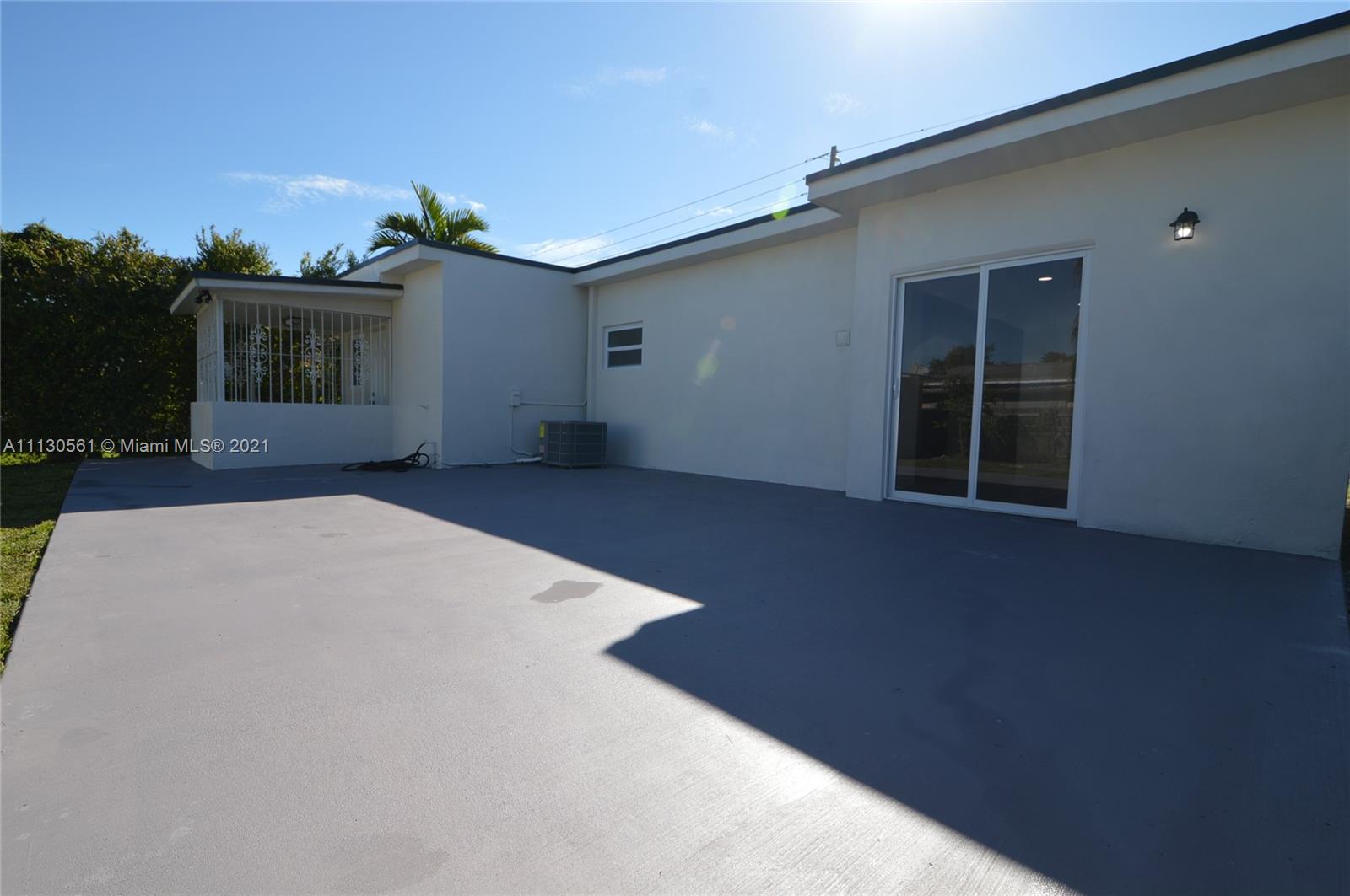 8935 Southwest 38th Street Miami, FL 33165 - Photo 19 of 24 front view of a house with a yard
