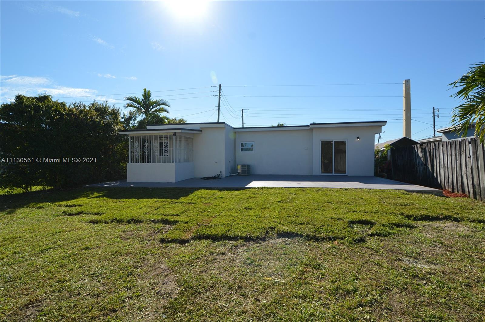 8935 Southwest 38th Street Miami, FL 33165 - Photo 20 of 24 a backyard of a house
