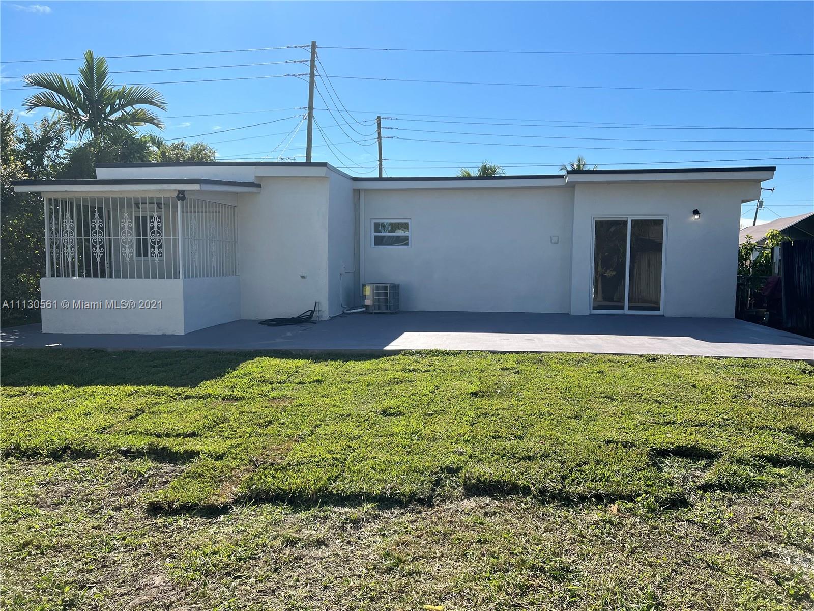 8935 Southwest 38th Street Miami, FL 33165 - Photo 21 of 24 a view of a backyard with plants