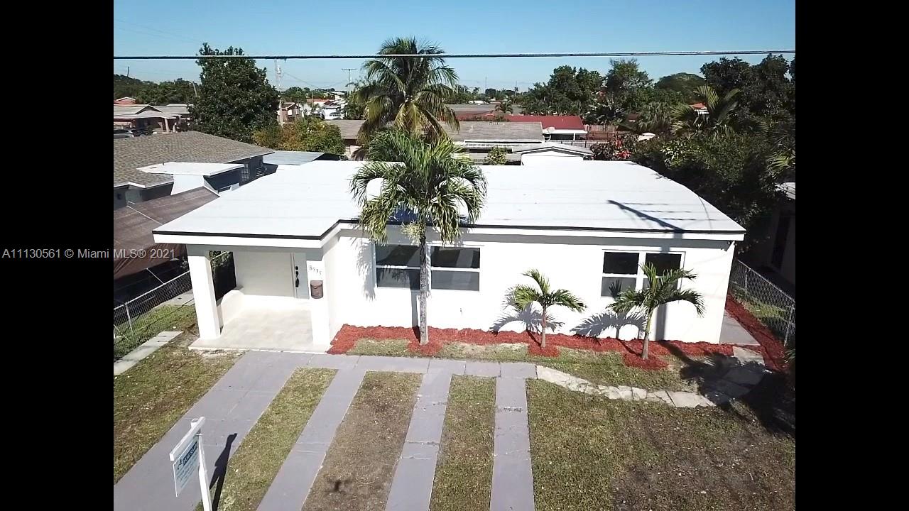 8935 Southwest 38th Street Miami, FL 33165 - Photo 23 of 24 a view of a patio with table and chairs with wooden floor and fence