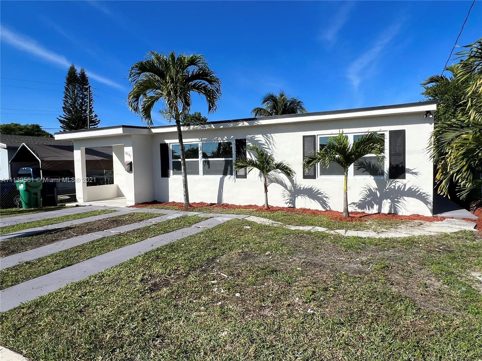 8935 Southwest 38th Street Miami, FL 33165 - Photo 24 of 24 a view of a house with backyard and porch