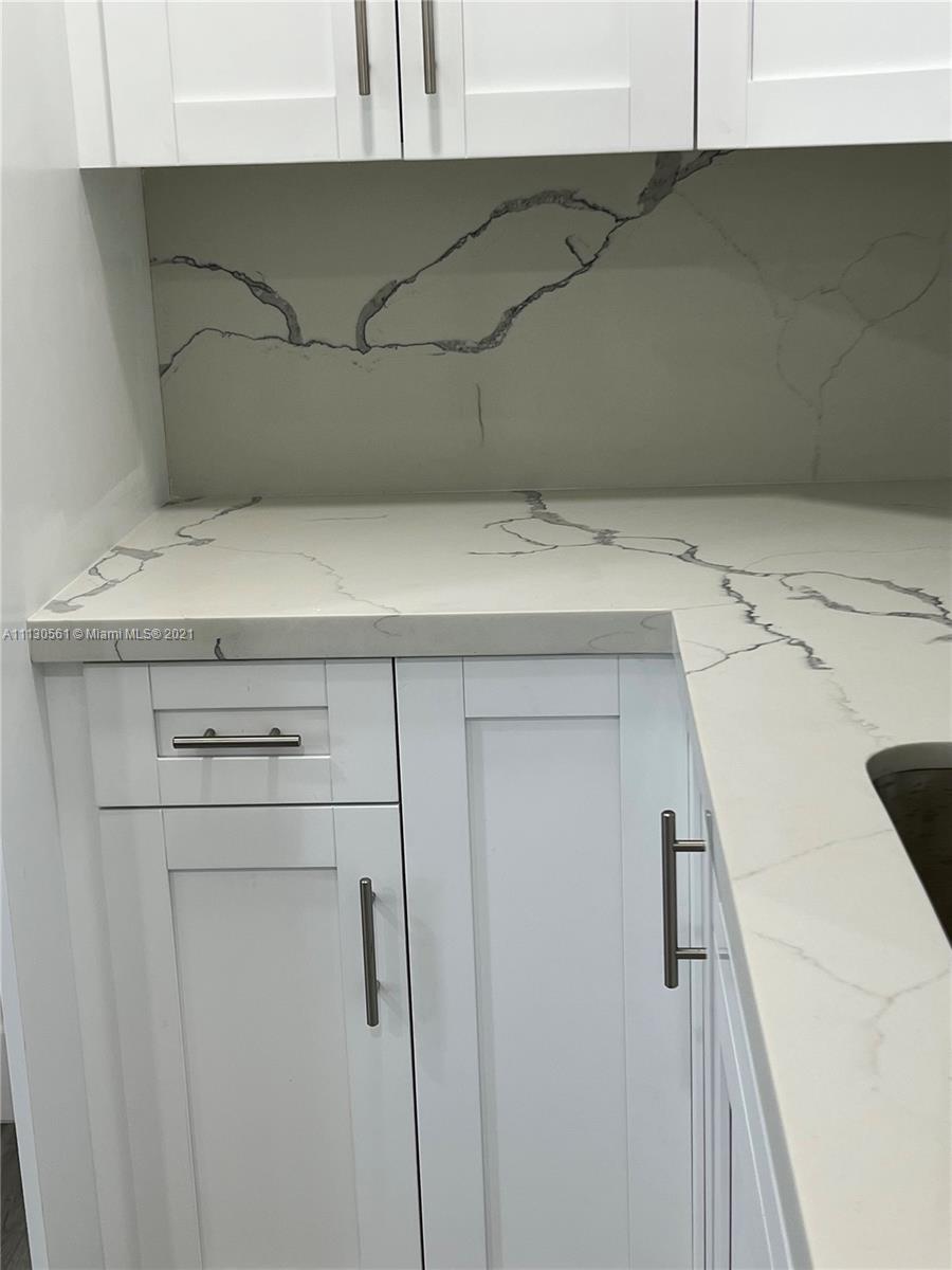 8935 Southwest 38th Street Miami, FL 33165 - Photo 7 of 24 a utility room with dryer and washer