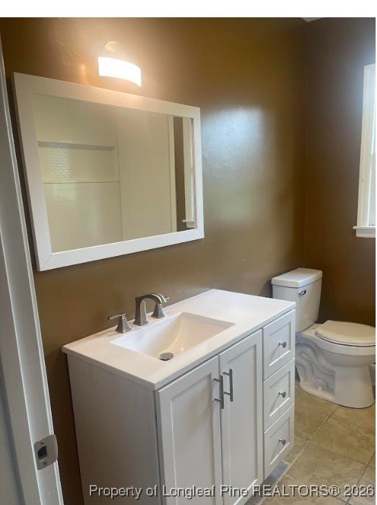 1374 McLean Chapel Church Road Bunnlevel, NC 28323 - Photo 11 of 17 a bathroom with a sink toilet and mirror