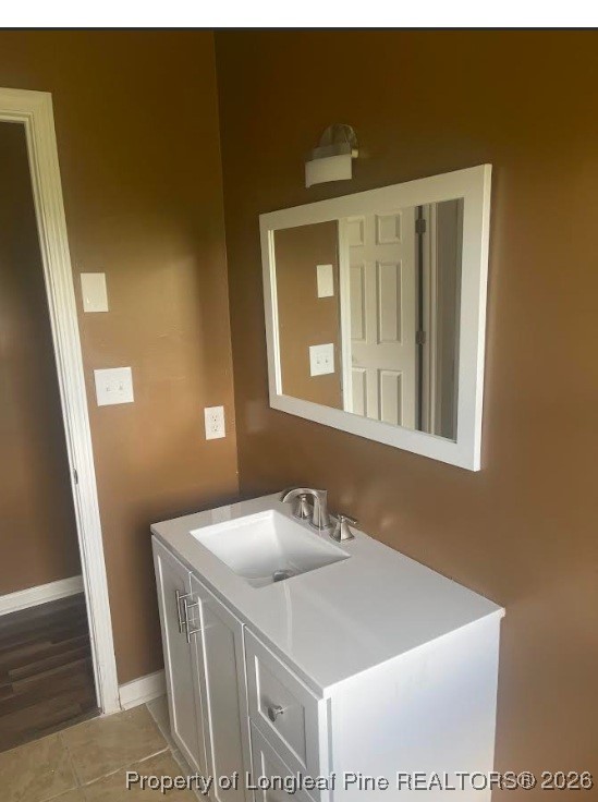 1374 McLean Chapel Church Road Bunnlevel, NC 28323 - Photo 13 of 17 a bathroom with a sink and a mirror