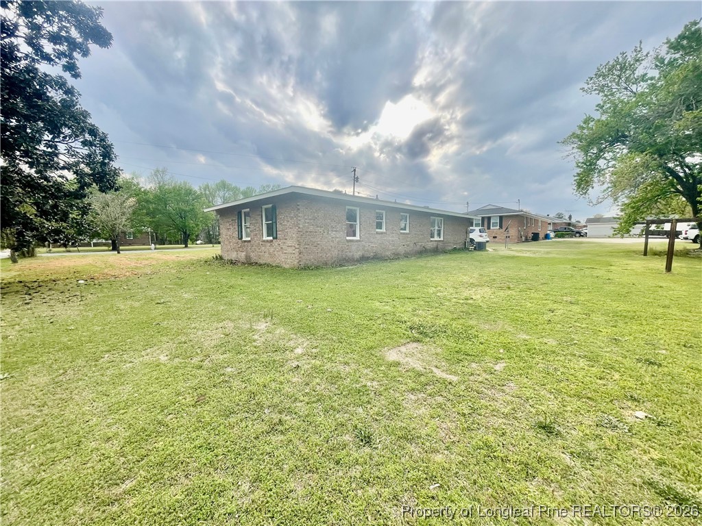 1374 McLean Chapel Church Road Bunnlevel, NC 28323 - Photo 15 of 17 a view of a patio with a yard