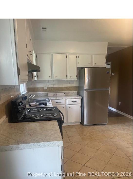 1374 McLean Chapel Church Road Bunnlevel, NC 28323 - Photo 5 of 17 a kitchen with a refrigerator and a sink