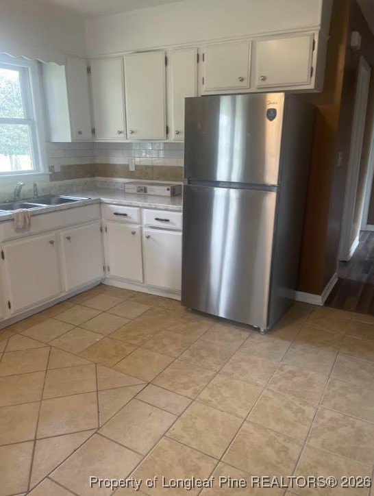 1374 McLean Chapel Church Road Bunnlevel, NC 28323 - Photo 6 of 17 a kitchen with stainless steel appliances a refrigerator sink and cabinets