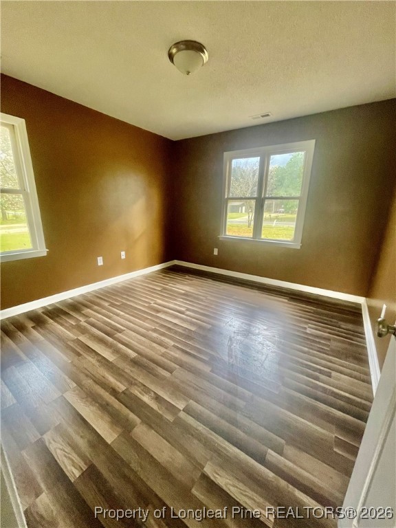 1374 McLean Chapel Church Road Bunnlevel, NC 28323 - Photo 9 of 17 a view of an empty room with wooden floor and a window