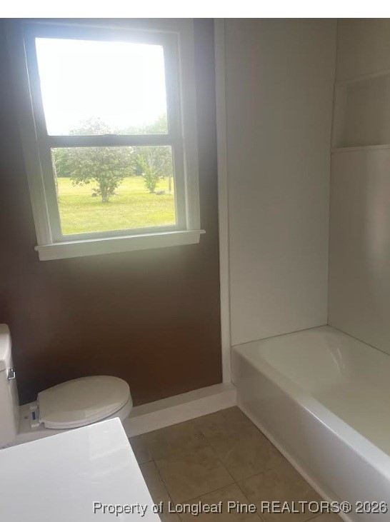1374 McLean Chapel Church Road Bunnlevel, NC 28323 - Photo 10 of 17 a bathroom with a toilet and window