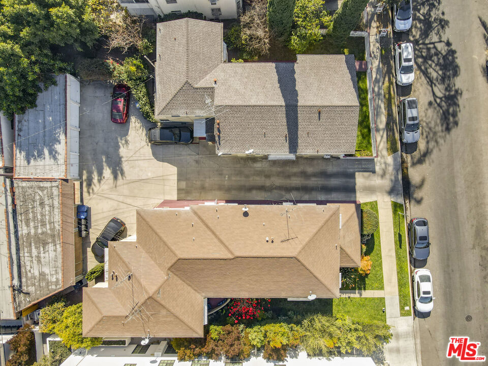 116 South Kings Road Los Angeles, CA 90048 - Photo 6 of 12 an aerial view of a house with a yard and large tree