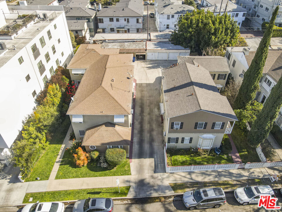 116 South Kings Road Los Angeles, CA 90048 - Photo 10 of 12 an aerial view of a house with a yard and large trees