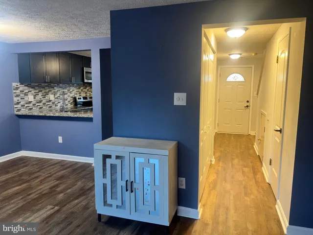 a view of livingroom with furniture and wooden floor