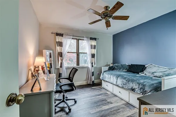 a bedroom with furniture and a window