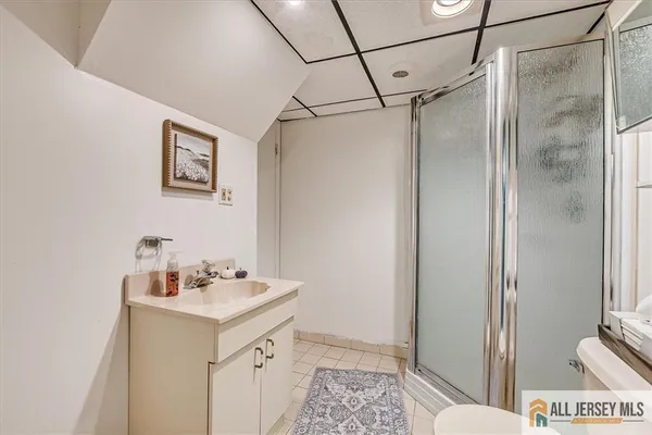 a bathroom with a sink and mirror