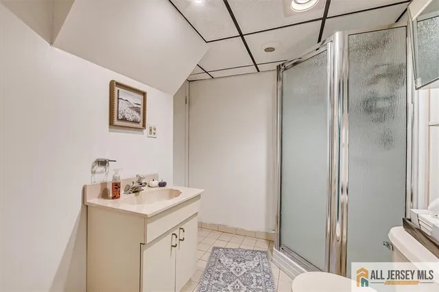 a bathroom with a sink and mirror