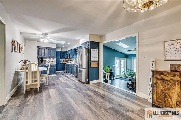 a view of kitchen with furniture and wooden floor