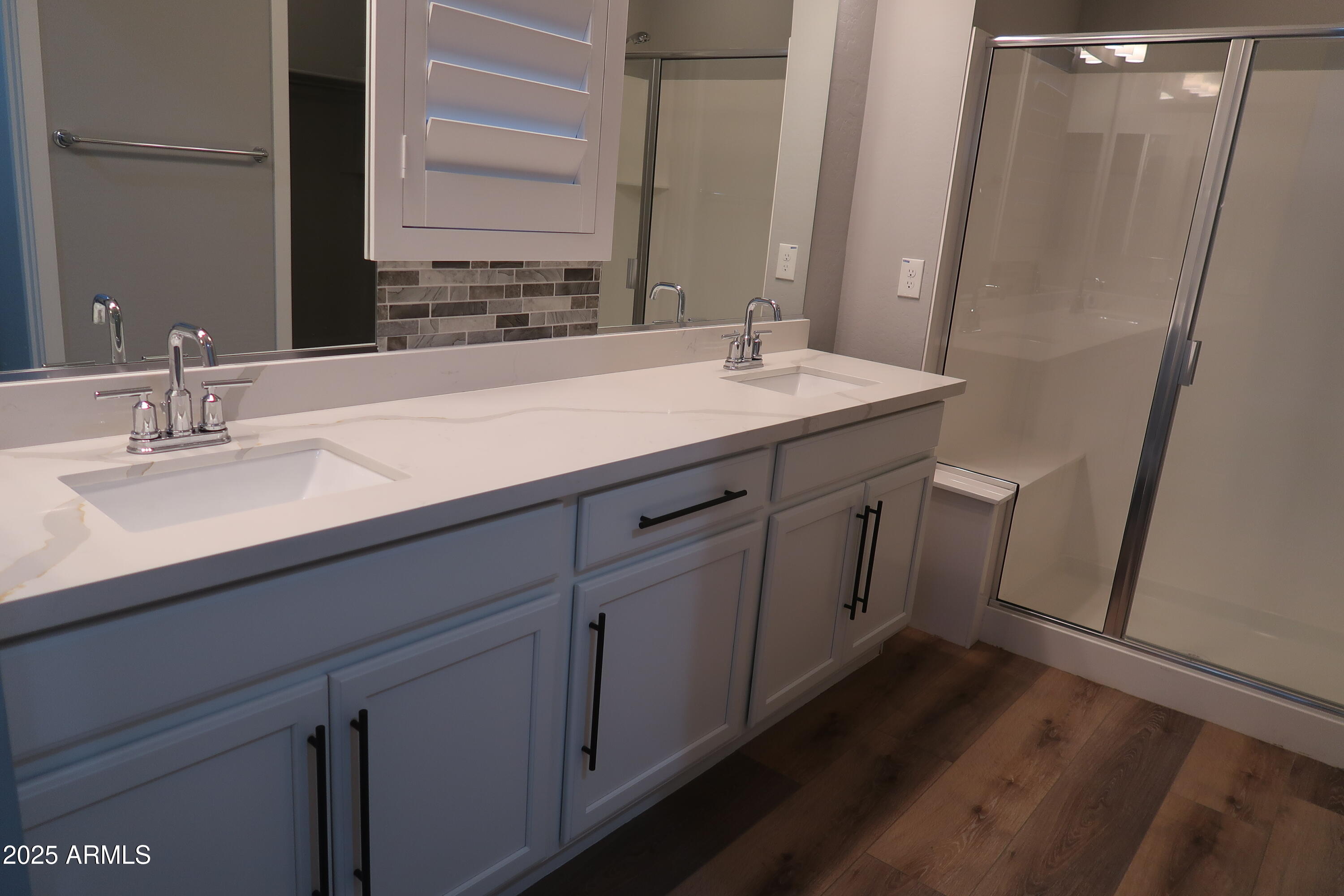 2852 East Robin Lane Phoenix, AZ 85050 - Photo 19 of 58 a bathroom with a double vanity sink and a mirror