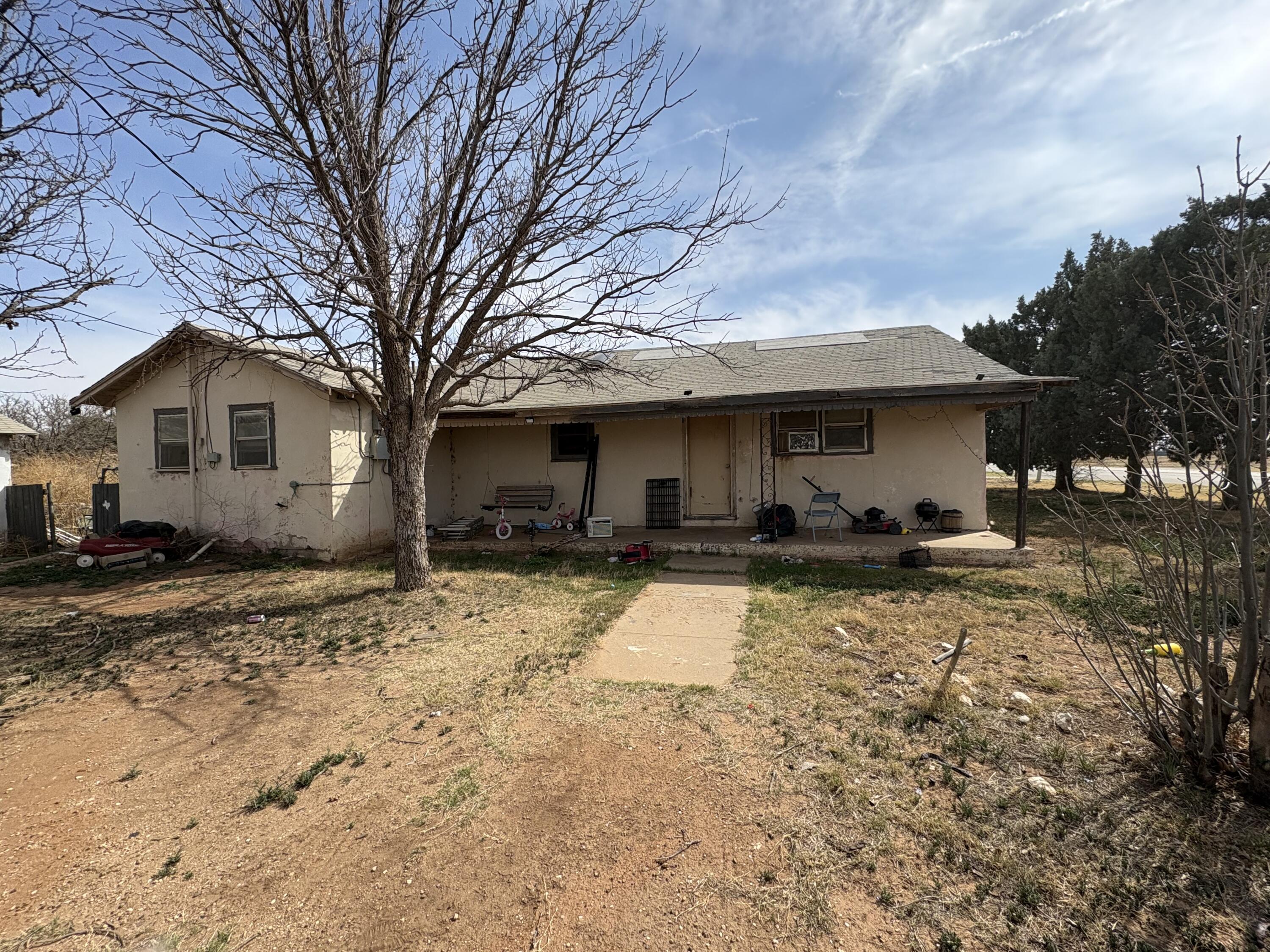 102 4th Street Whitharral, TX 79336 - Photo 1 of 4 a view of a house with a yard covered in snow
