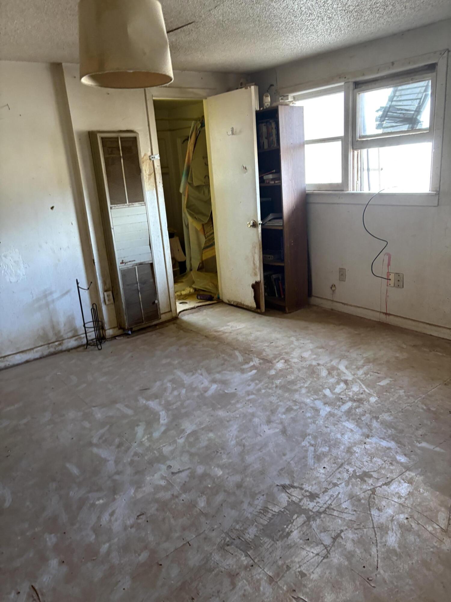 102 4th Street Whitharral, TX 79336 - Photo 4 of 4 an empty room with windows